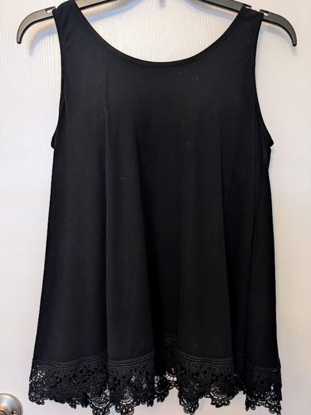 Black swing tank top with built-in bra. Size L